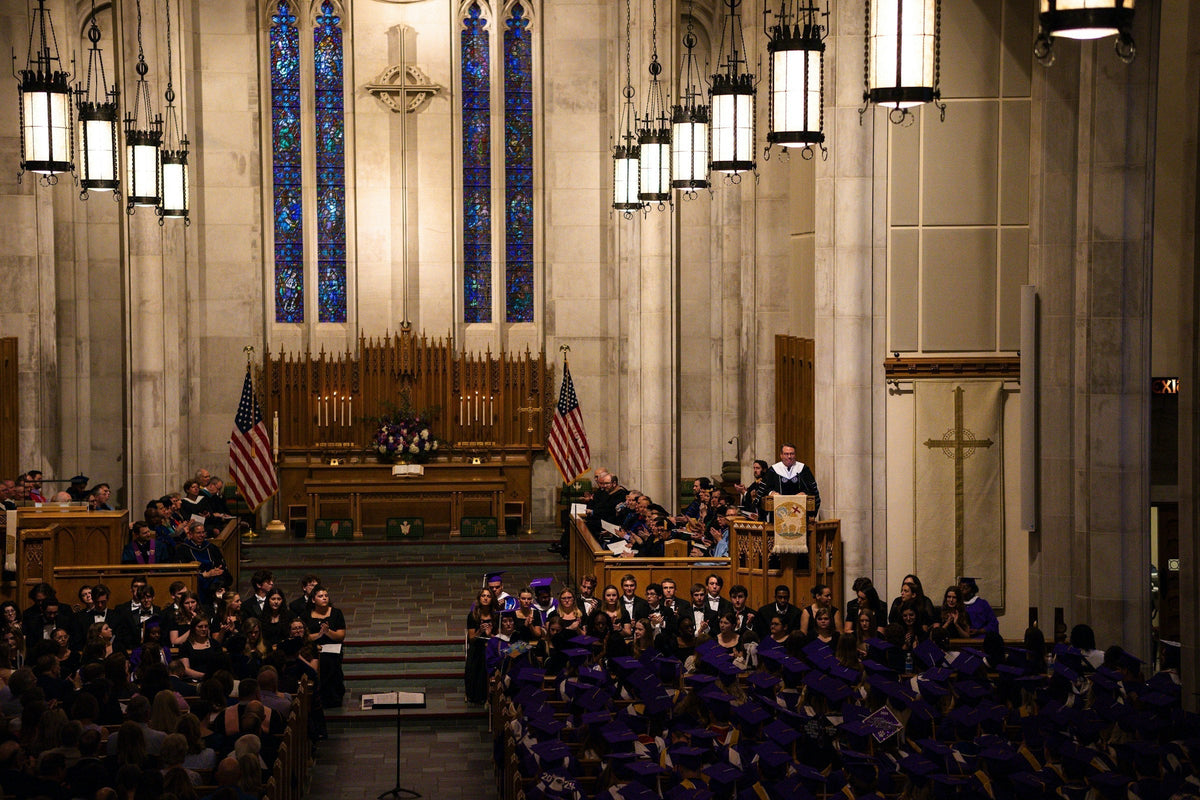 A large group of people gathered inside a big church